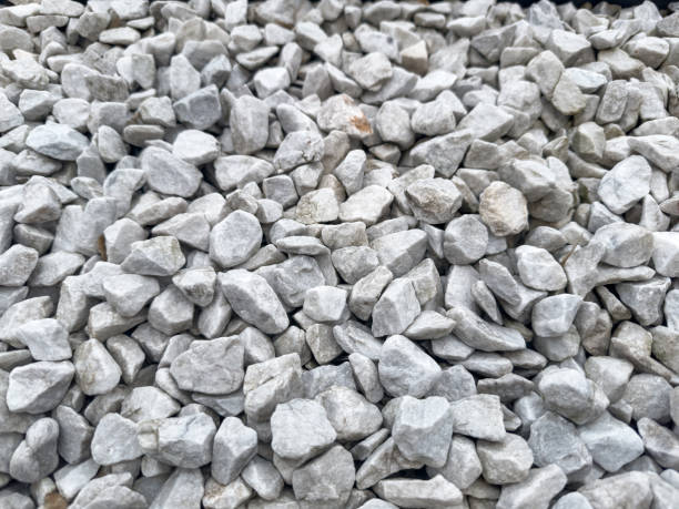 istock Small pebbles for building materials or home design, light grey gravel for texture 2156014296