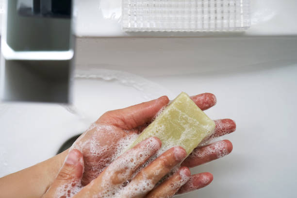 istock The process of washing hands with natural soap over the sink. 2156014447