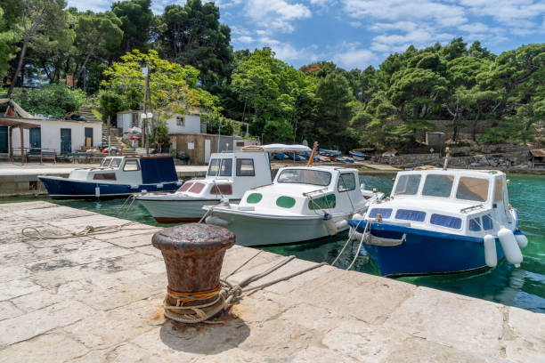 Kolocep island with leisure craft moored on the Adriatic in Gornje Celo harbour.