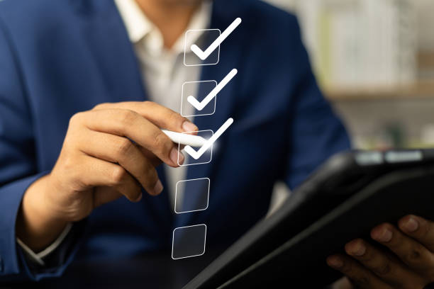 istock Digital Checklists for efficient business management, Businessman touching marking on checklist guide to paperless assessment and Future Success, Streamlining operations with online surveys. 2156017383