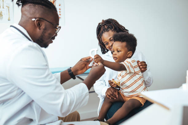 istock Pediatric Checkup for Young Boy with Supportive Mother 2156017440