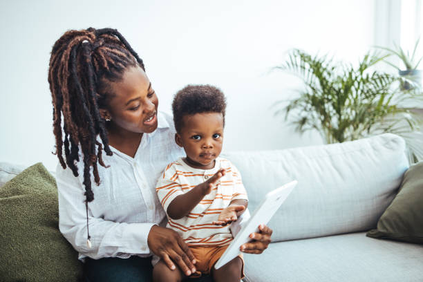 istock Joyful Interaction with Technology in Cozy Family Setting 2156017459