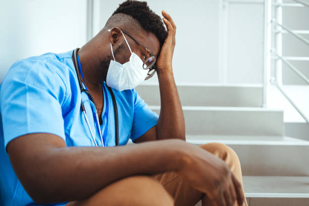 istock Tired African American Nurse Taking a Break 2156017579