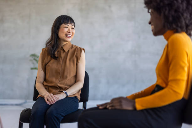 istock Diverse Businesswomen Engaged in Friendly Conversation 2156017624