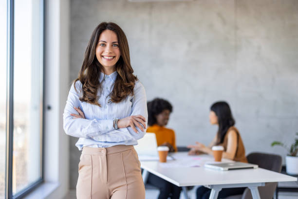 istock Confident Businesswoman in Modern Office Setting 2156017644
