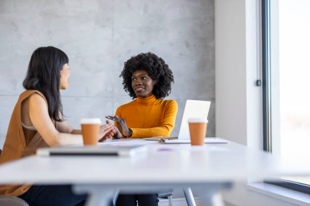 istock Diverse Businesswomen Discuss Strategy in Office 2156017657