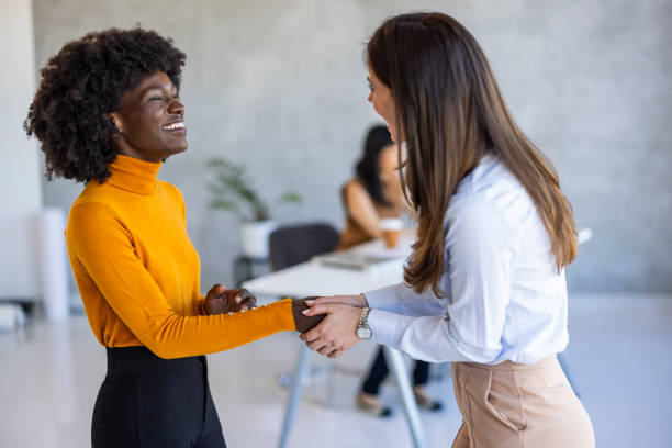 istock Diverse Businesswomen Handshake in Office 2156017695