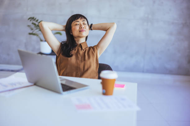 istock Serene Asian Businesswoman Enjoying Break at Work 2156017741