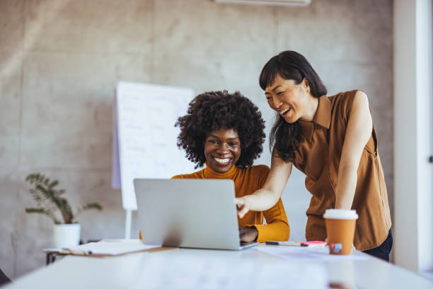 istock Diverse Businesswomen Engage in Teamwork 2156017757