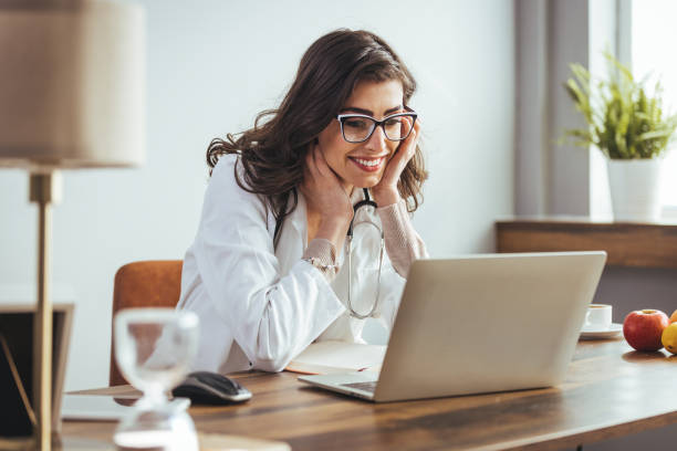 istock Caucasian Female Doctor Operating Laptop in Office 2156018009