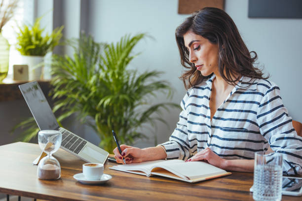 istock Professional Female Executive Working at Her Desk 2156018051