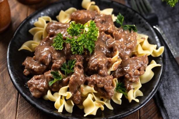 istock Beef stroganoff with egg noodles garnished with parsley 2156020672
