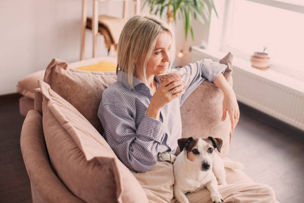 istock Calm peaceful Woman drinking tea or coffee at home 2156024438