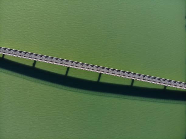 Austria drone view. Narrow road bridge over reservoir Annabrucke on River Drau. Infrastructure of Carinthia.