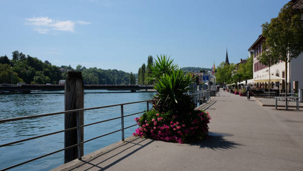 istock Park and street alongside river 2156026048