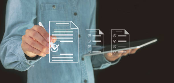 istock checklist Complete the performance review digital form checklist.business people using evaluation questionnaire evaluation 2156027276
