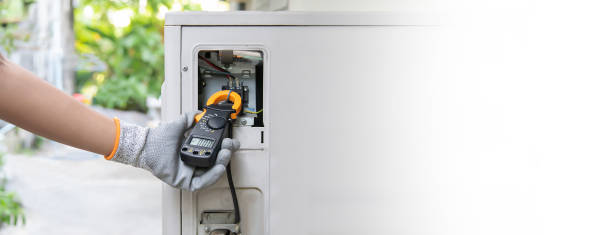 istock Air conditioning, HVAC service technician using gauges to check refrigerant and add refrigerant. 2156027296