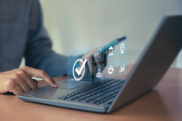 istock Businessman ISO symbol showing quality assurance on virtual screen 2156027297