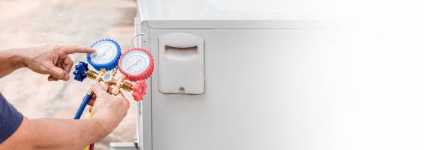 istock Air conditioning, HVAC service technician using gauges to check refrigerant and add refrigerant. 2156027298