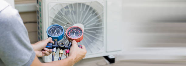 istock Air conditioning, HVAC service technician using gauges to check refrigerant and add refrigerant. 2156027326