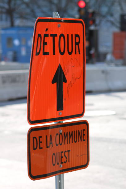 istock Orange detour sign with a directional arrow 2156035420