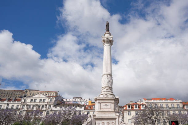 istock White monument surrounded by trees on a street 2156035425
