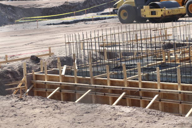 istock Construction site with machinery, and wooden scaffolding 2156035486