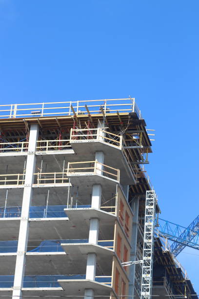 istock Crane near a construction site with a building under construction 2156035487