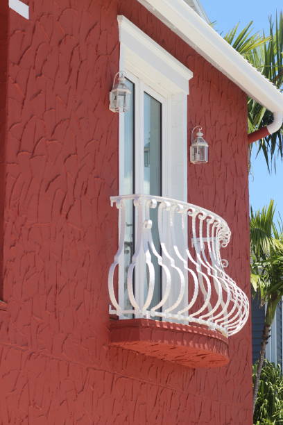 istock White-painted balcony on a red house 2156035491