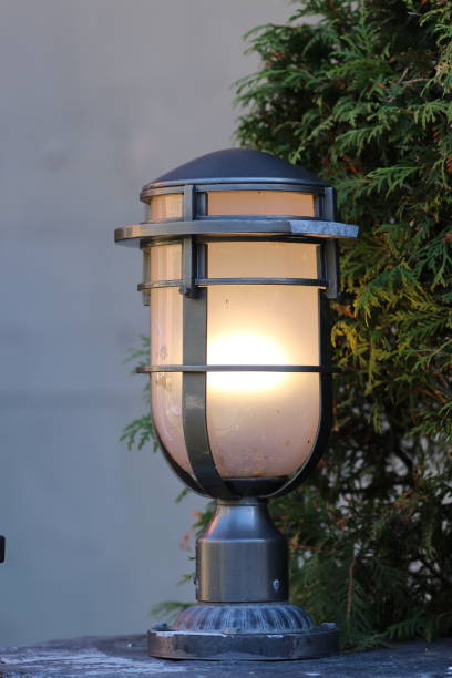 istock Lamp with a glowing light illuminating the street 2156036261