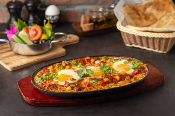 istock Pizza topped with eggs and fresh herbs 2156037691