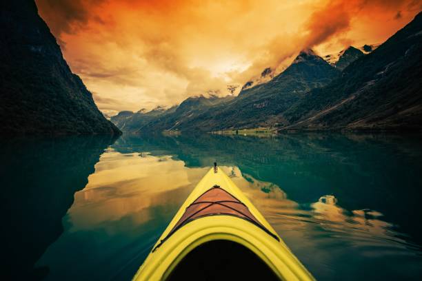 Shoot of young woman traveller on canoe enjoying nature views