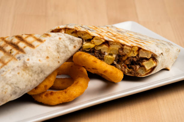 istock Halved burrito surrounded by onion rings 2156041465