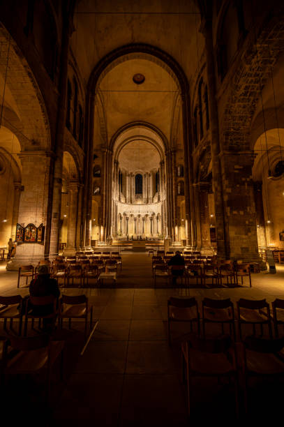 a cathedral with an altar and many benches in the center