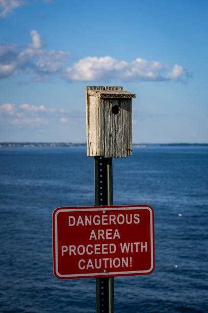 istock Warning sign advises swimmers to avoid water for safety 2156043991