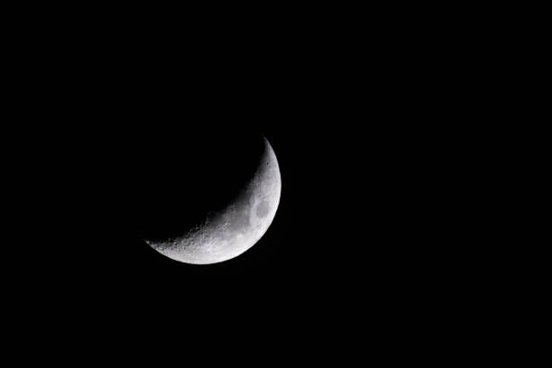 istock Crescent moon against a dark sky 2156044474