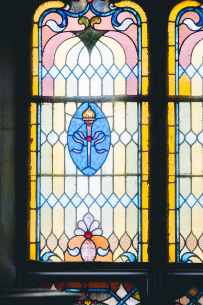 istock two stained glass windows in a small room with a flower 2156044702