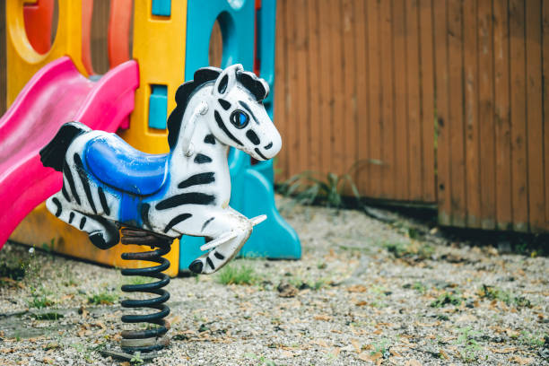 A miniature zebra toy perched on a spring tube toy