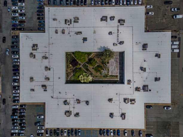 istock Top down view over a large office building with air conditioner units on the roof. 2156044771