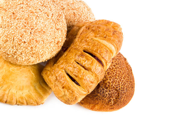 Fresh baked wheat buns isolated on white background. Free space for text.