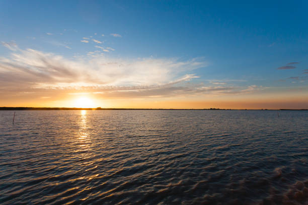 A sunset over Delta del Po lagoon in Italy.