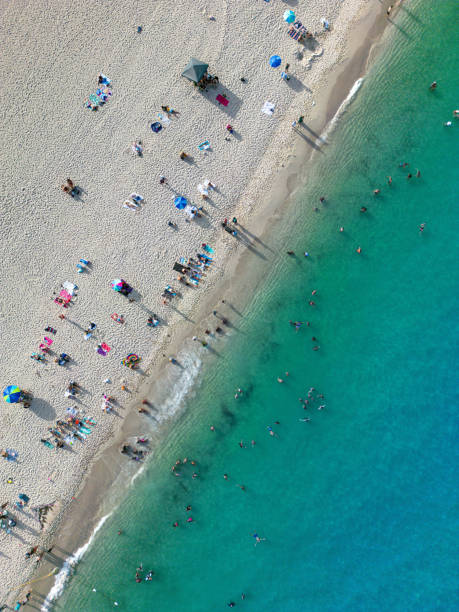 istock Aerial view of beachgoers at Miami Beach, FL 2156048587