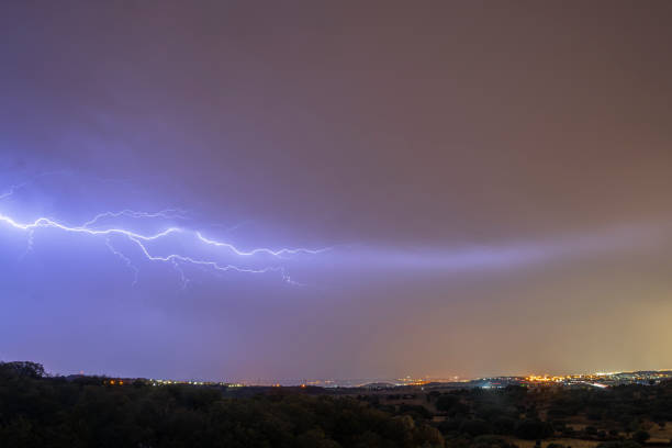 istock A spectacular night storm dominates the sky, marked by significant lightning. 2156048902