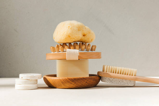 istock Set eco friendly bath devices. A soap bar with natural bath sponge and brush for body self-massage on a concrete background 2156051301