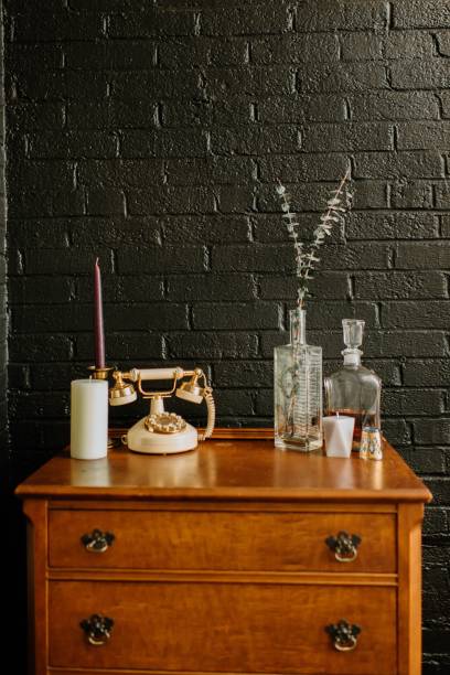 istock a table with a lamp, vases and bottles on it 2156051880