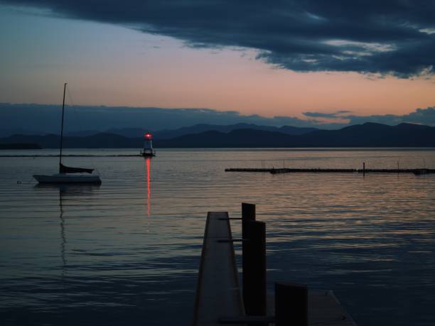istock Summer sunset reflecting on water surface in Vermont 2156053838
