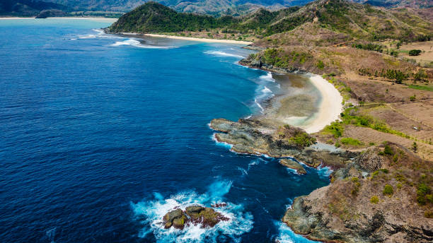 istock Beautiful deserted and isolated tropical beach surrounded by clear blue ocean (Semeti Beach) 2156056513
