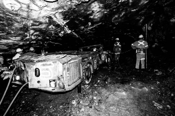 Johannesburg, South Africa – April 01, 2024: Monochrome image of coal miners working underground