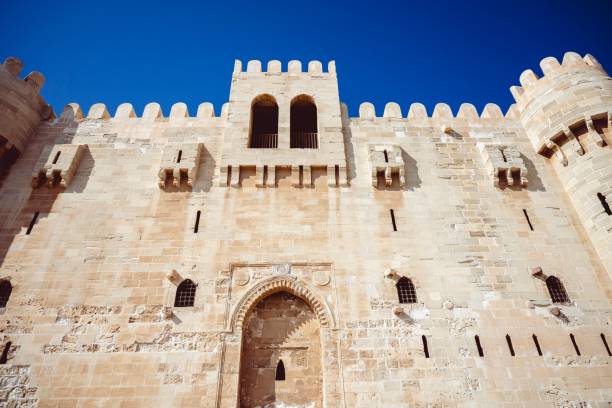 istock Stone building with numerous windows set against a clear blue sky 2156056958