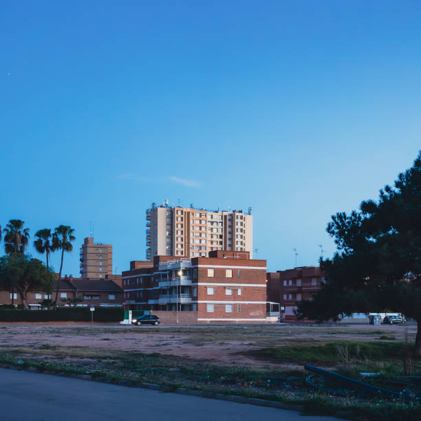 istock Brick building with other taller residential building behind it during dawn 2156057375